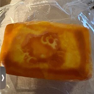 Taba squishy looks like a mini pound cake with the image of hello kitty fidget t